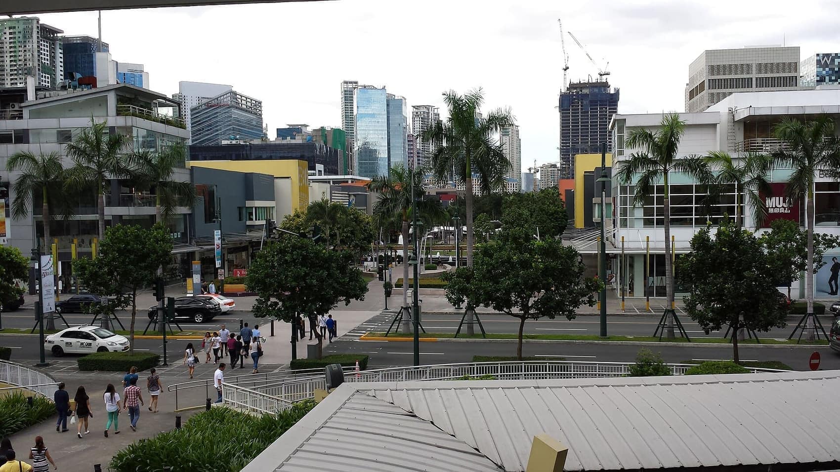 Bonifacio High Street from above, towers closing in on both sides