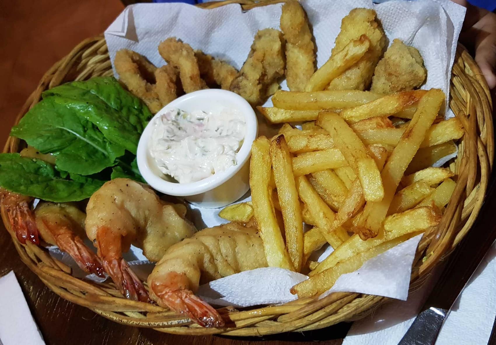 The Seafood Basket: battered fish, whole prawns, calamari and chips with tartare