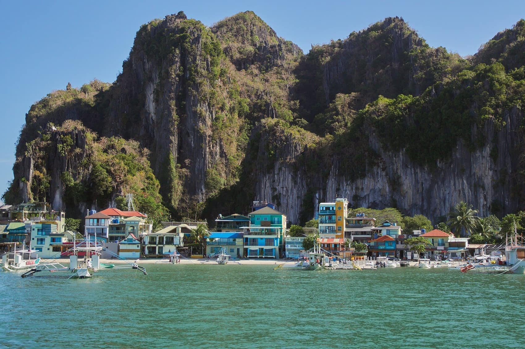 El Nido town from the water. The whole place is squeezed between the beach and Taraw Cliff
