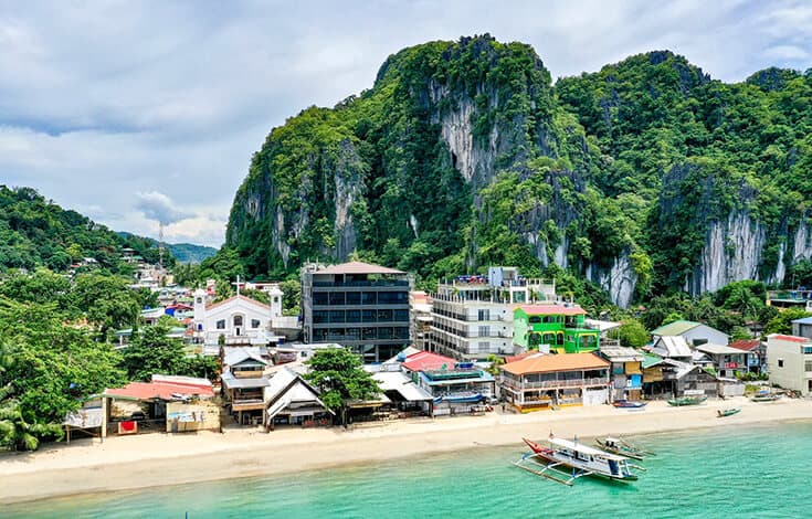 El Nido's town beach and limestone wall: one minute from the front door