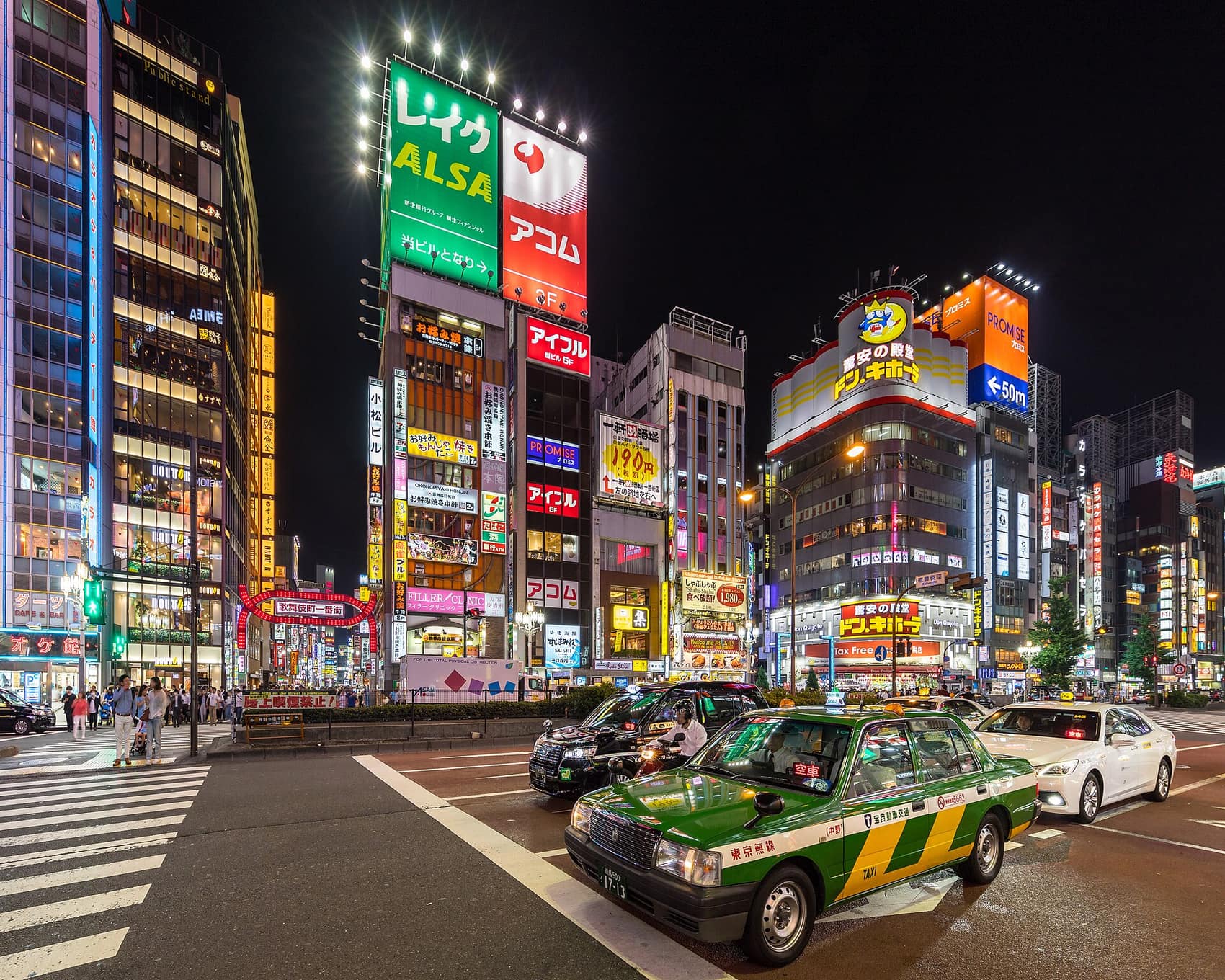 Neon-lit Yasukuni-dori Avenue in Shinjuku after dark