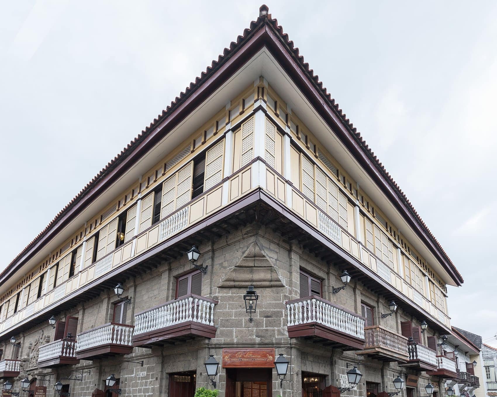 Casa Manila's facade: stone below, wood and capiz shell above, the classic bahay na bato