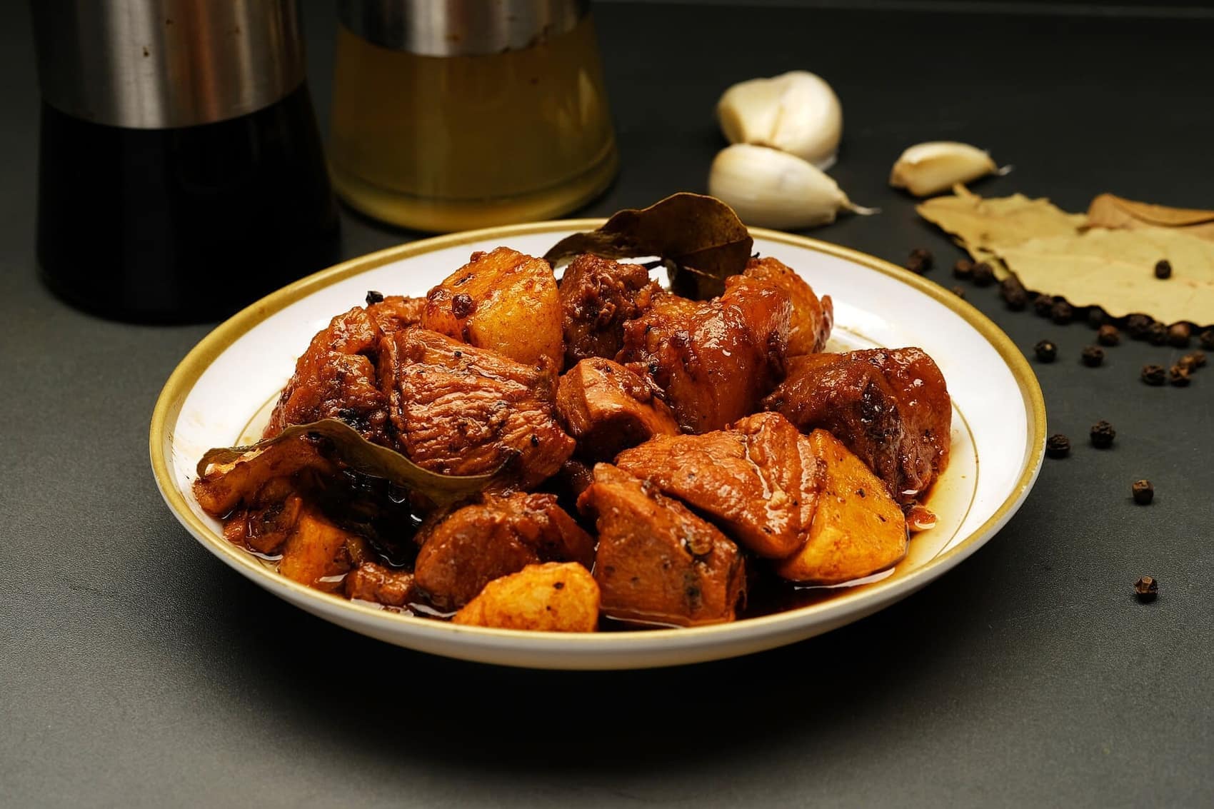 Adobo, the national argument: soy, vinegar, garlic, black pepper, bay leaf