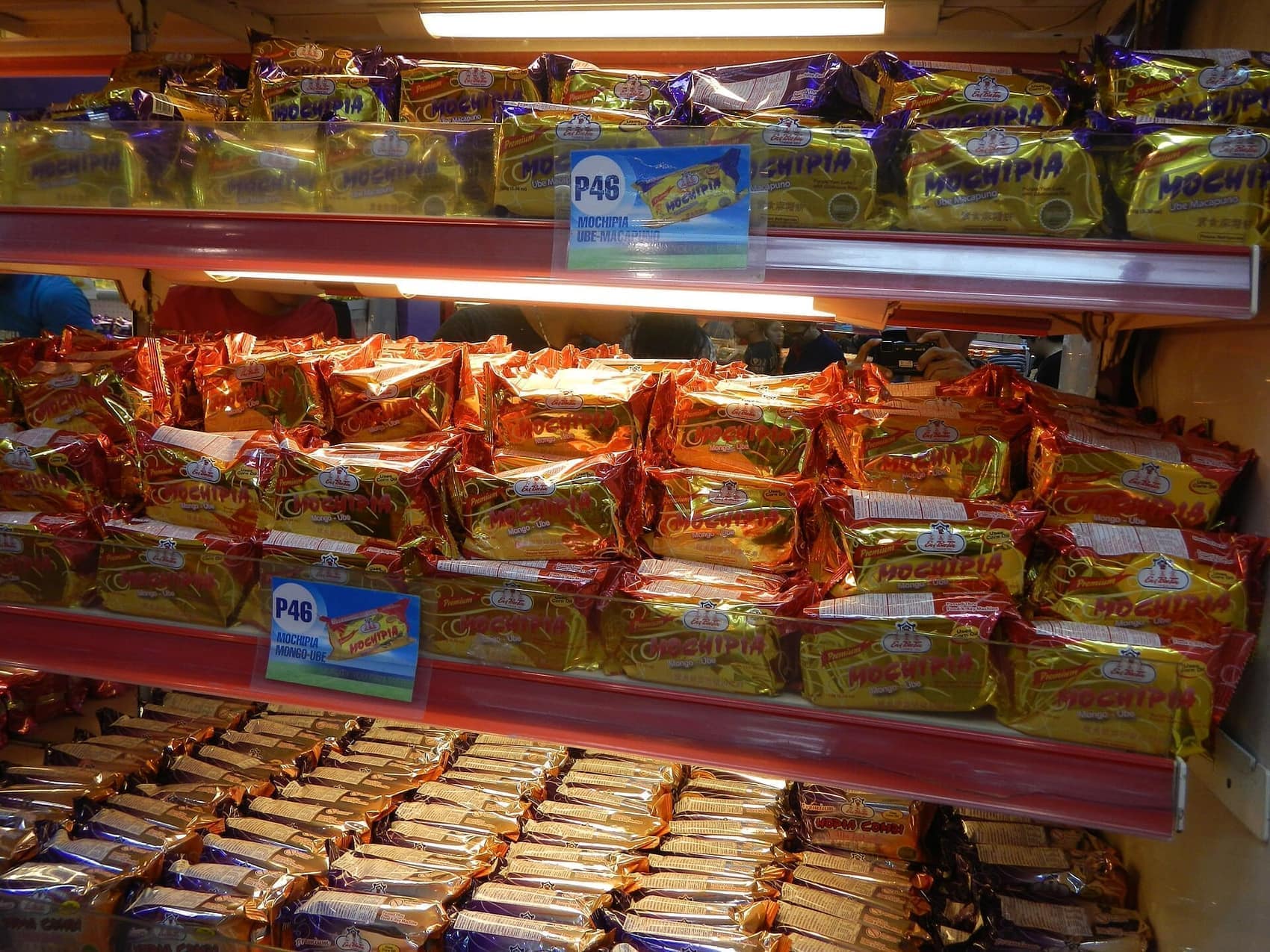 Hopia and tikoy stacked in a Binondo Chinese deli: the take-home half of the food crawl