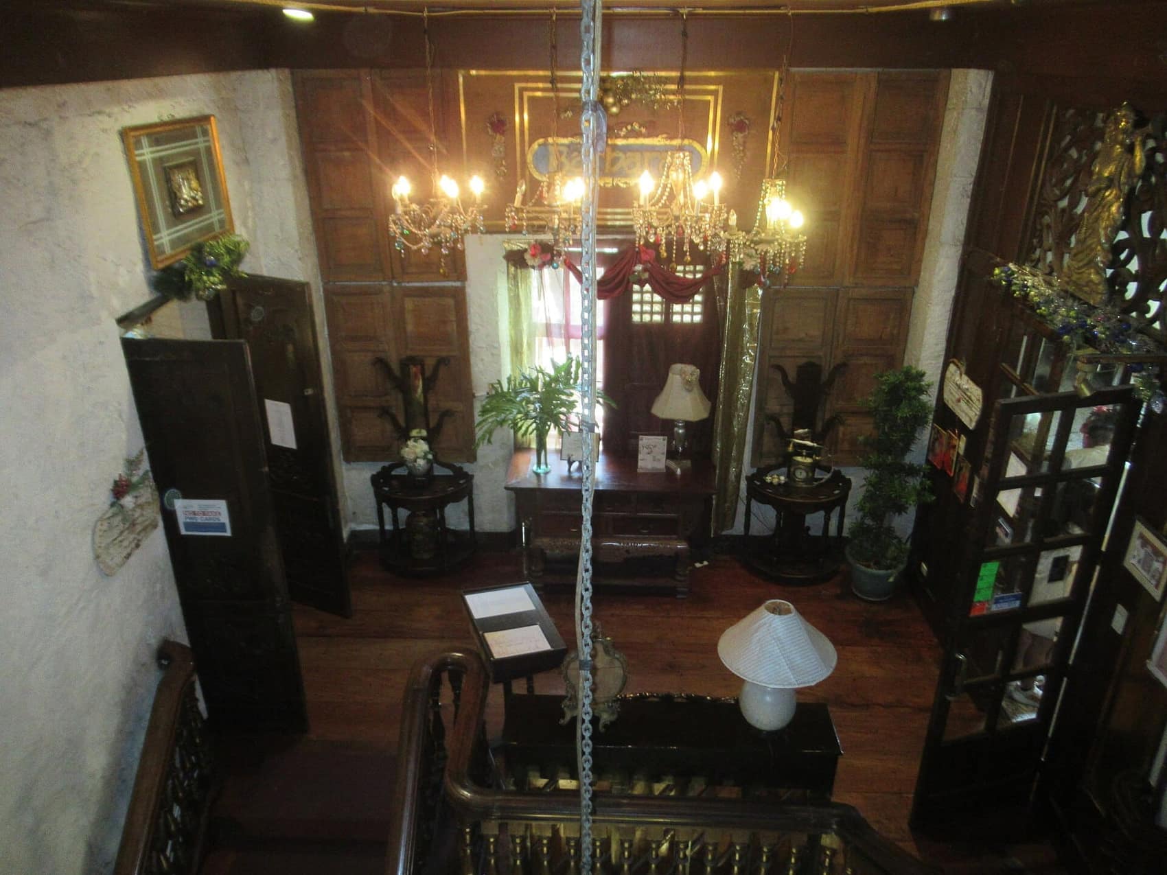 Heritage-house dining room, chandeliers and narra furniture: the old-Manila register