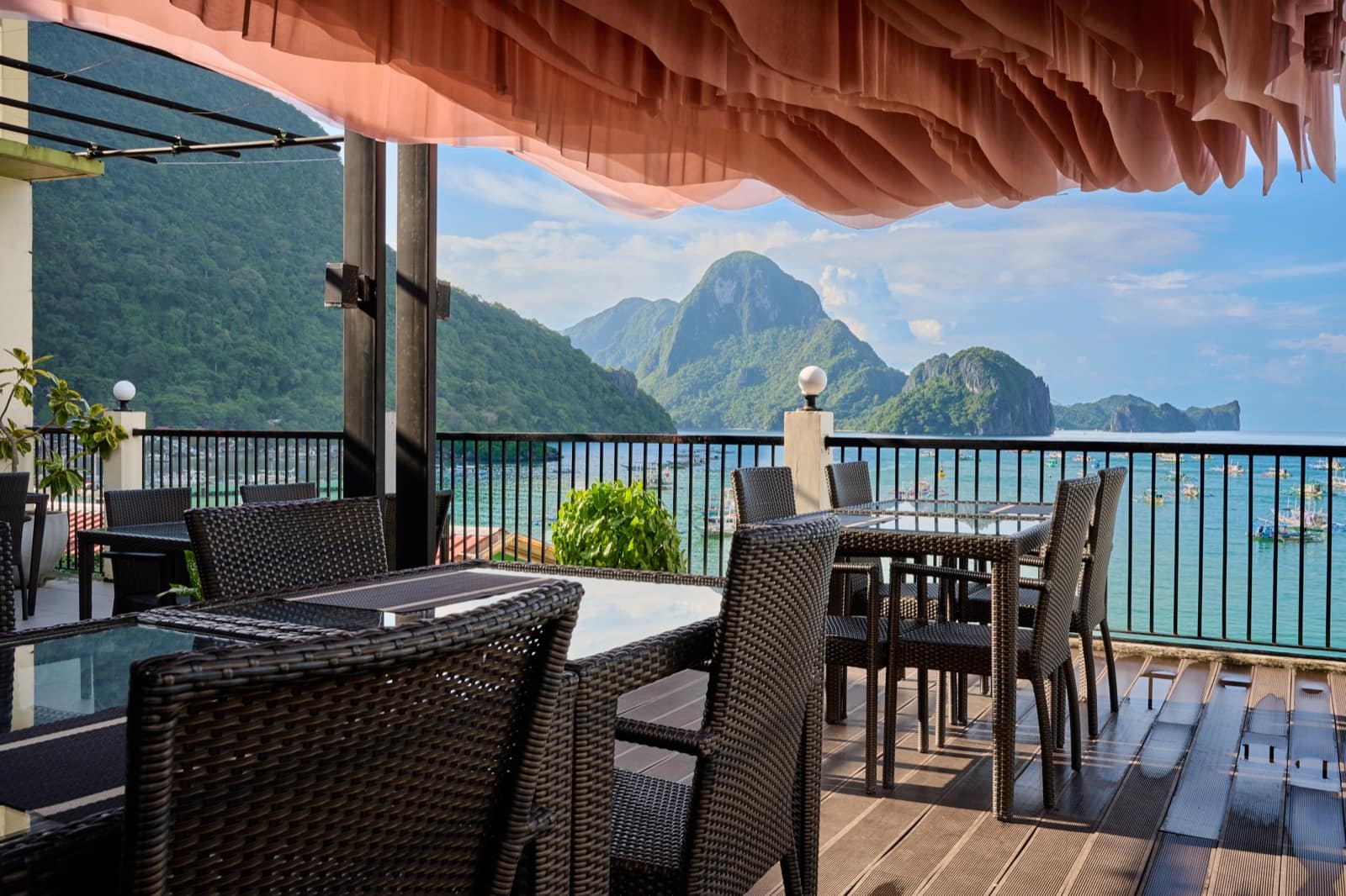 Rooftop restaurant terrace overlooking Bacuit Bay's limestone islands