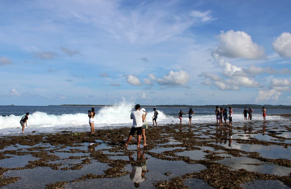 The lineup at Cloud 9: surfers waiting on the reef shelf that made Siargao famous