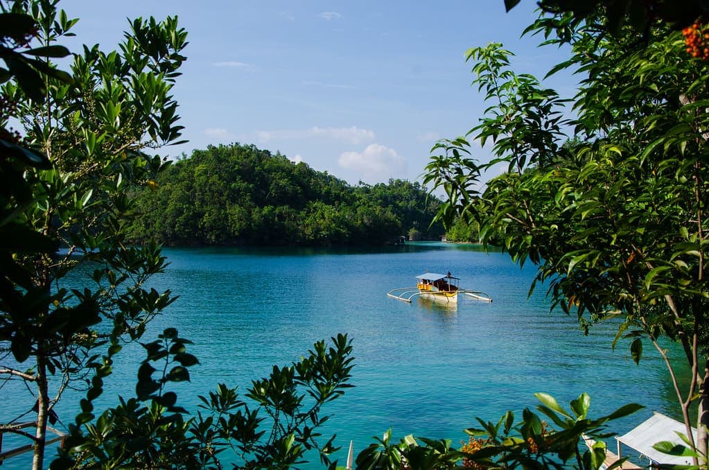 Sohoton Cove: jade water walled in by jungle-topped limestone